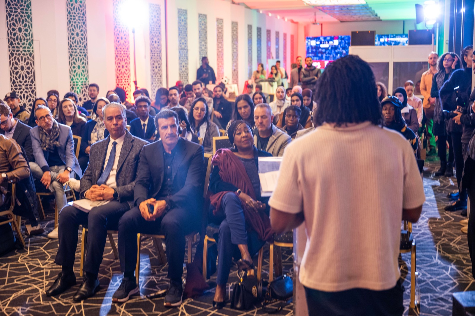 Bboy Junior speaking to a packed audience